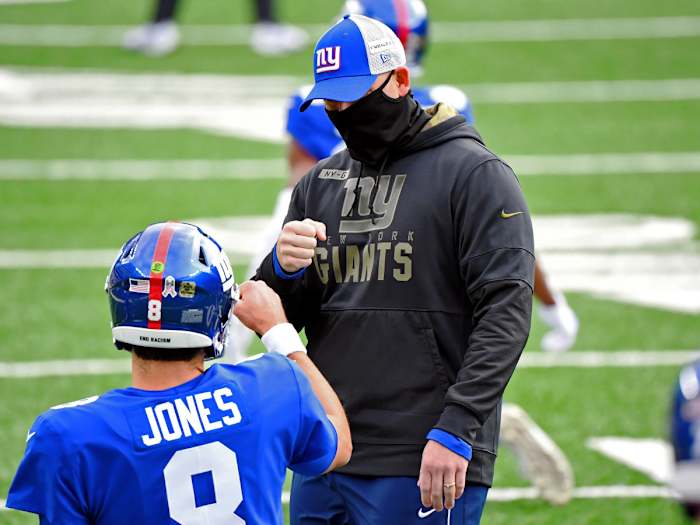 Nov 15, 2020; East Rutherford, New Jersey, USA; New York Giants head coach Joe Judge fist bumps quarterback Daniel Jones (8) before their game against the Philadelphia Eagles at MetLife Stadium.